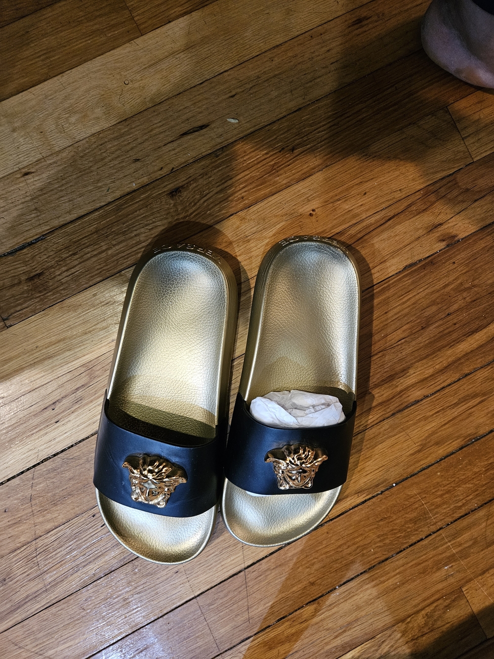 Gold and Black Slide Sandals with Medallion Accent